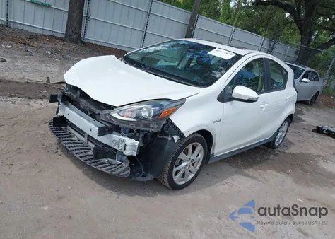 2018 Toyota Prius C Four from USA, damaged, VIN JTDKDTB35J1602314